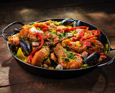 paella served with shrimp in wok