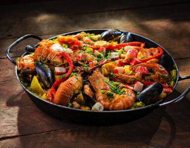 paella served with shrimp in wok