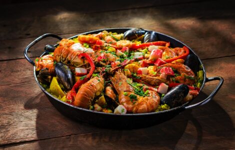 paella served with shrimp in wok