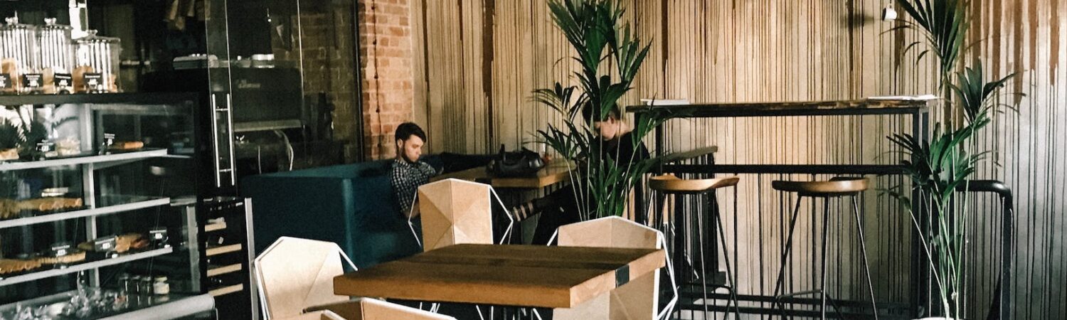 man sitting by the table in cafe