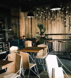 man sitting by the table in cafe