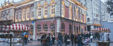 photo of people walking near buildings