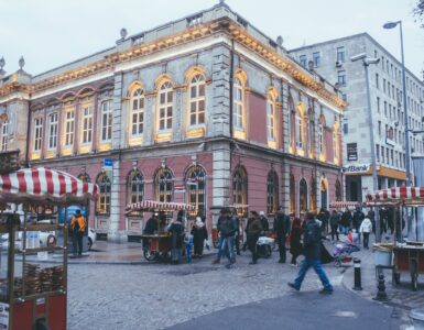 photo of people walking near buildings