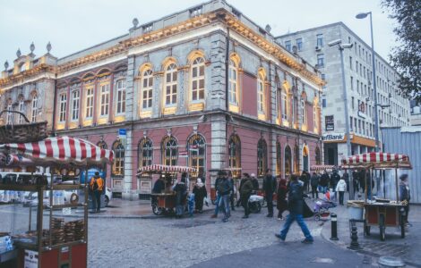 photo of people walking near buildings