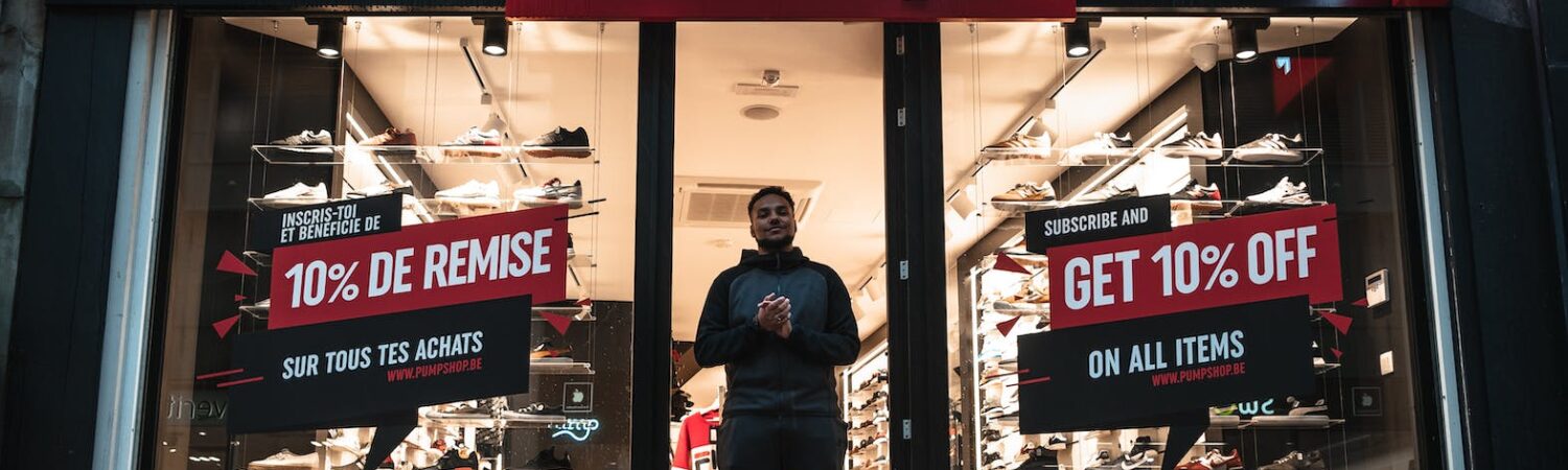 man standing at the doorway of pump shop