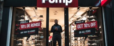 man standing at the doorway of pump shop