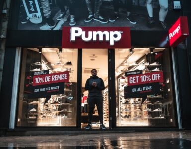 man standing at the doorway of pump shop