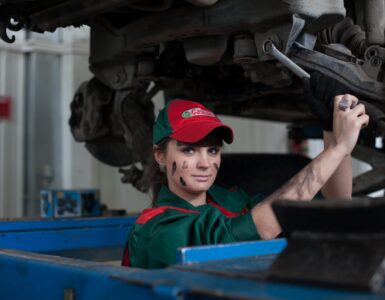 woman holding gray steel wrench