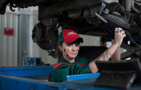 woman holding gray steel wrench