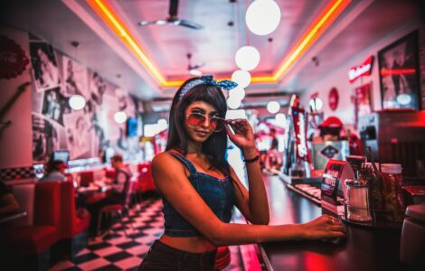 woman lowers her sunglasses
