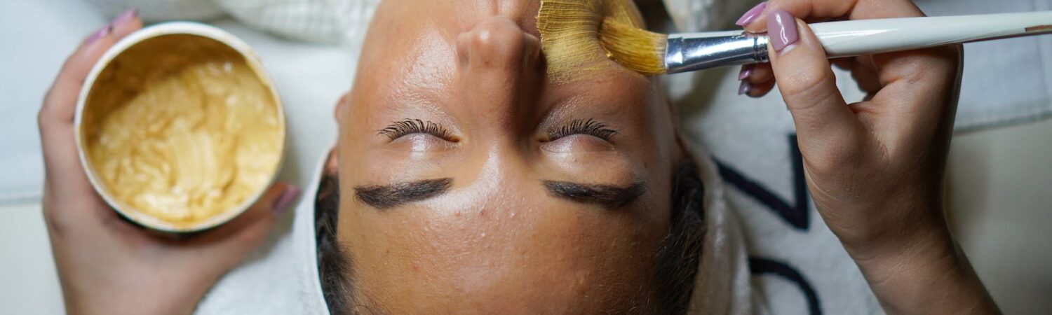 woman doing facial mask