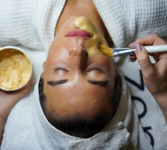 woman doing facial mask