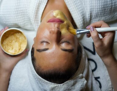 woman doing facial mask