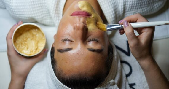 woman doing facial mask