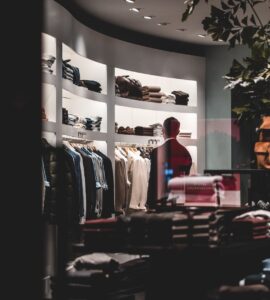 anonymous stylish man during shopping in fashion store