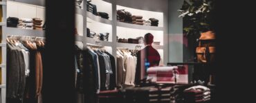 anonymous stylish man during shopping in fashion store