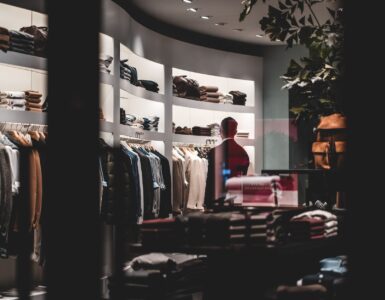 anonymous stylish man during shopping in fashion store