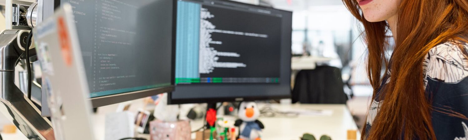 woman coding on computer