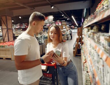 young couple selecting food in market