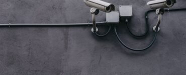 two gray bullet security cameras