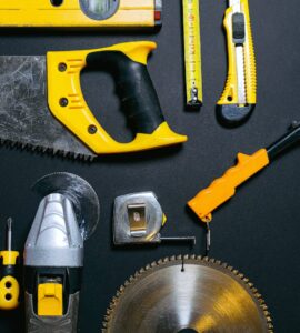 red and yellow hand tools on the table