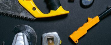 red and yellow hand tools on the table