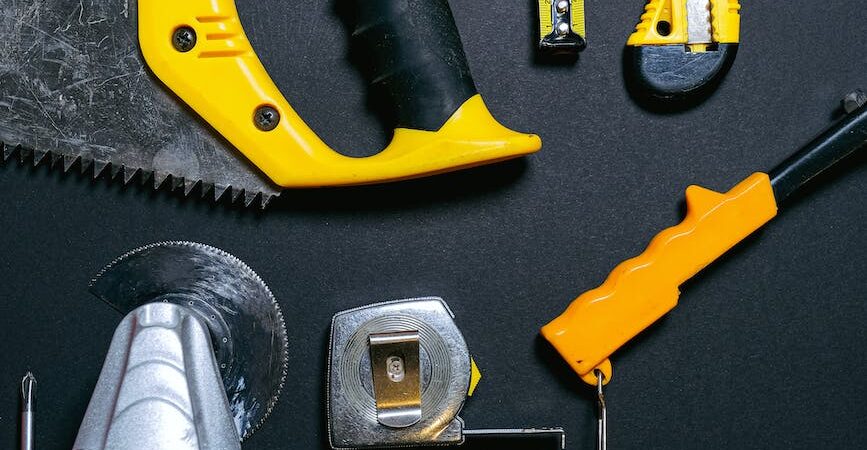 red and yellow hand tools on the table