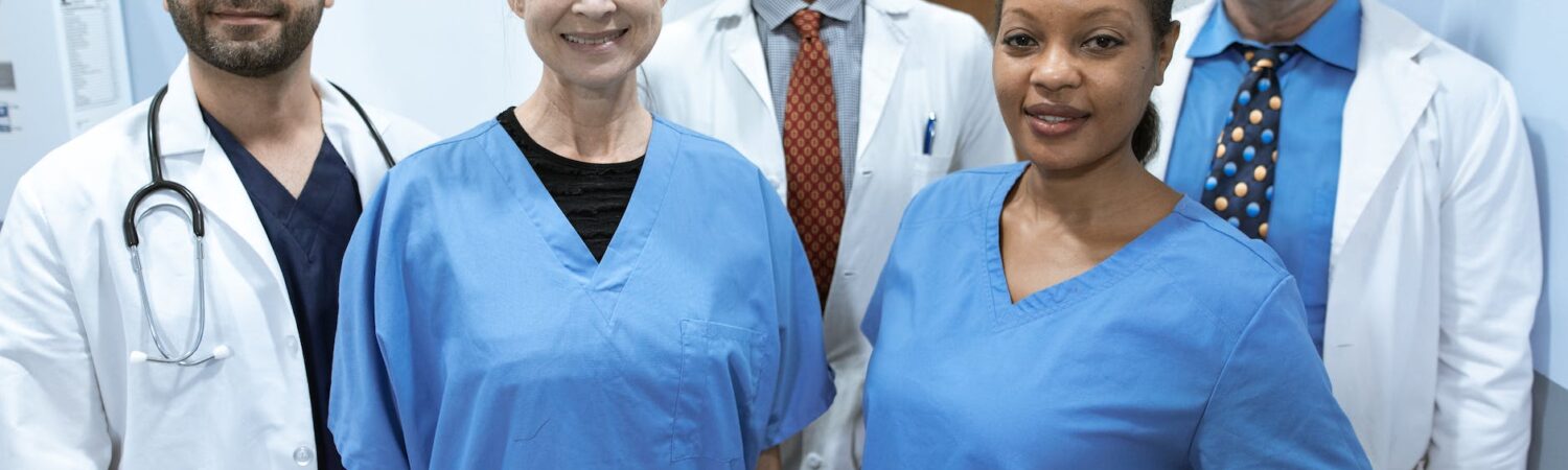 health care professionals smiling at the camera