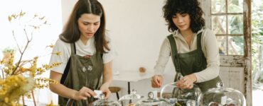 pensive waitress in apron serving table