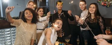 a team holding sparklers and having a celebration in the office