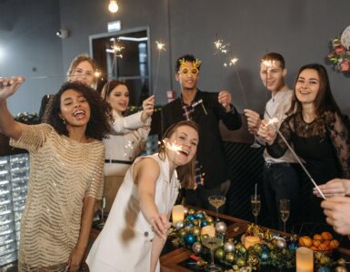 a team holding sparklers and having a celebration in the office