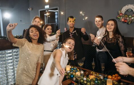 a team holding sparklers and having a celebration in the office