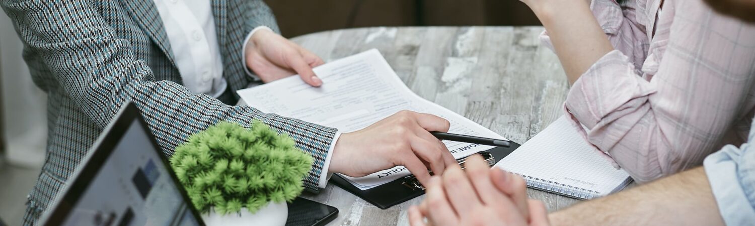 a woman holding a contract