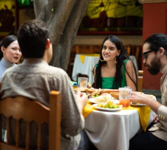 group of friends eating at mexican restaurant