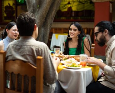 group of friends eating at mexican restaurant