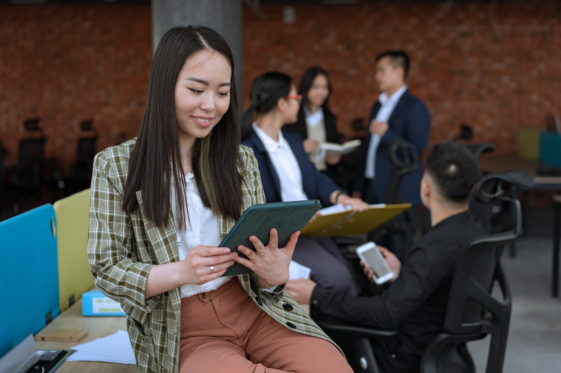 woman holding a tablet at the office