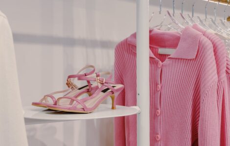 pink sandals beside a pink cardigan