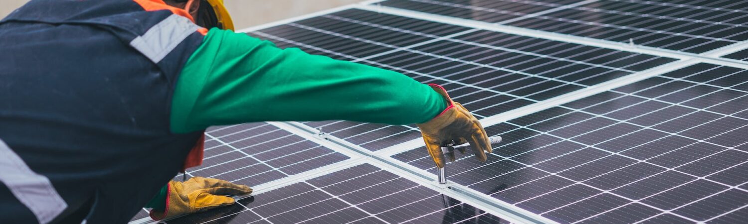 solar technician installing solar panel