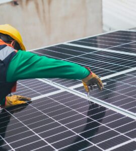 solar technician installing solar panel