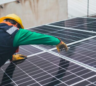 solar technician installing solar panel