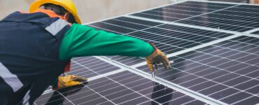 solar technician installing solar panel