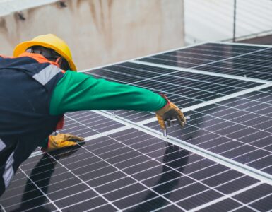 solar technician installing solar panel