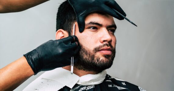 man taking beard shave